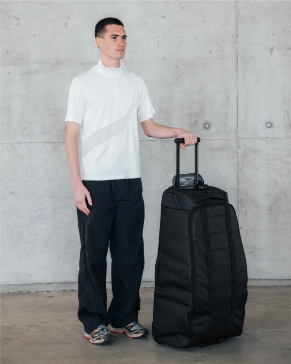 Torba podróżna na kółkach DB Hugger Roller 90L 6.png.webp